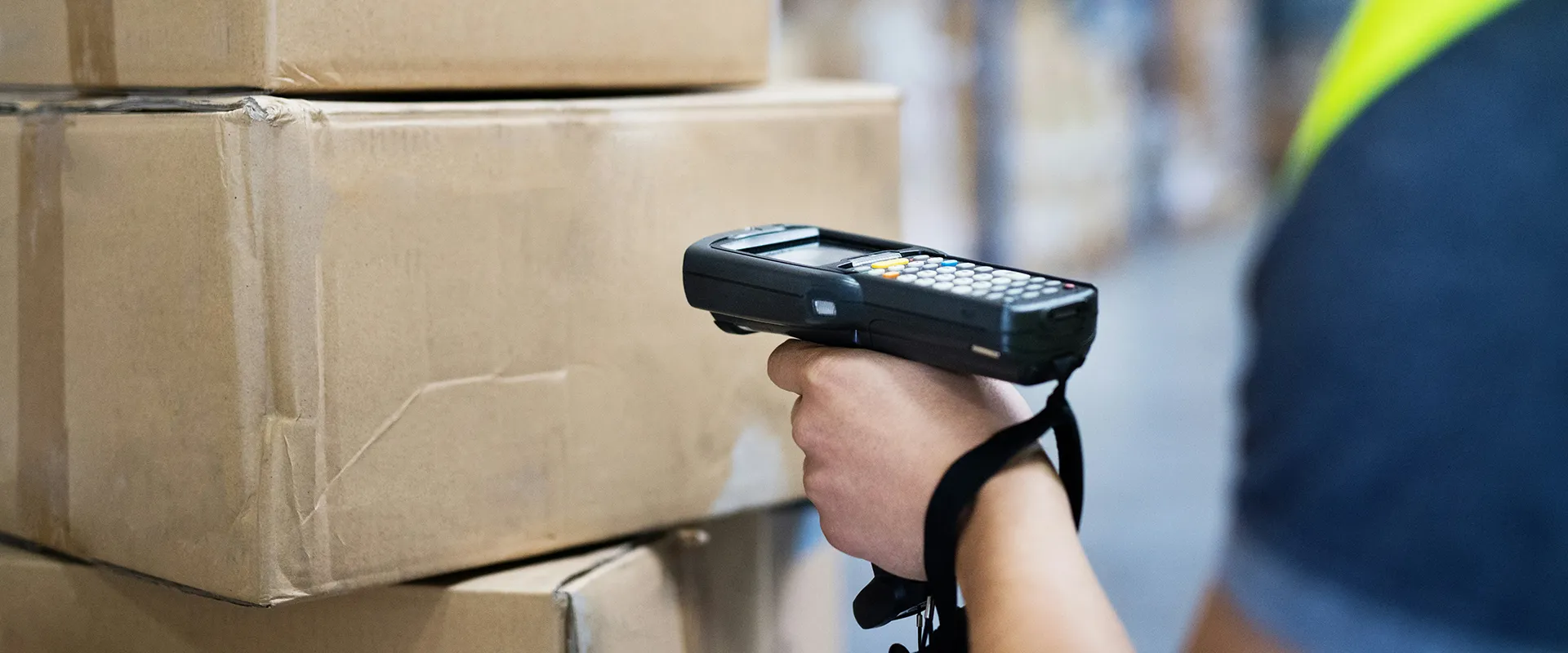 Worker using RFID handheld reader for rapid inventory counting